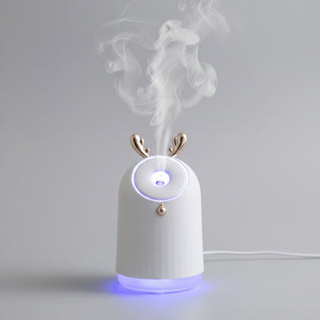 White humidifier with deer antler design on a blurred background